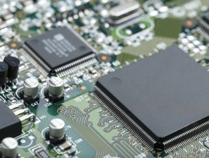 Closeup of electronic circuit board with CPU microchip electronic components background