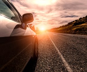 Car ride on road in sunny weather, motion blur